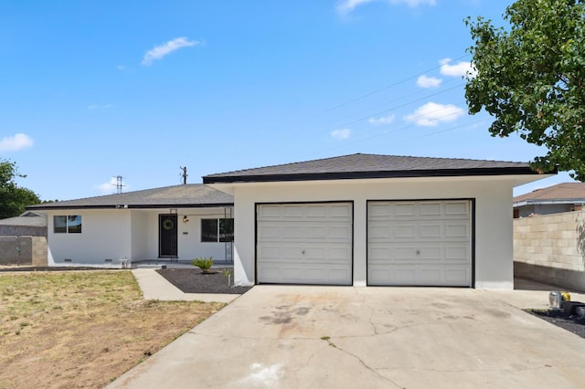 4641 E Weldon Ave, Fresno, CA 93703 - single story home featuring an attached garage, stucco siding, and concrete driveway