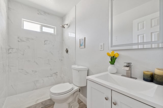 4641 E Weldon Ave, Fresno, CA 93703 - bathroom with toilet, vanity, and a marble finish shower