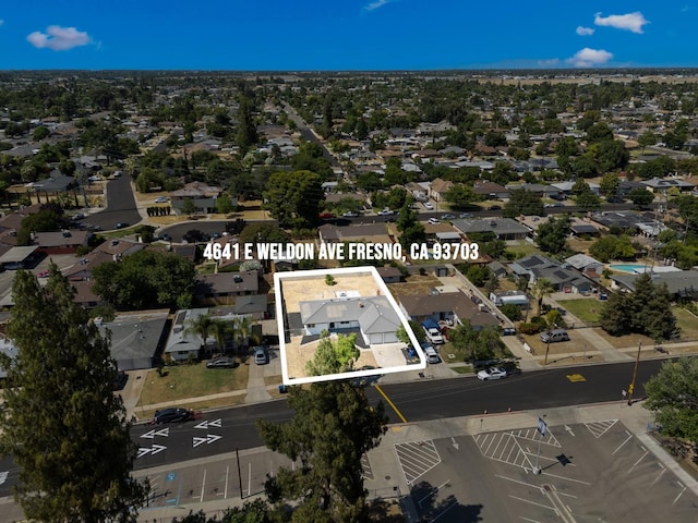 4641 E Weldon Ave, Fresno, CA 93703 - aerial view of property's location with property parcel outlined and nearby suburban area