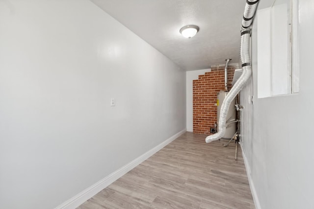 4641 E Weldon Ave, Fresno, CA 93703 - interior space with gas water heater, baseboards, and light wood-type flooring