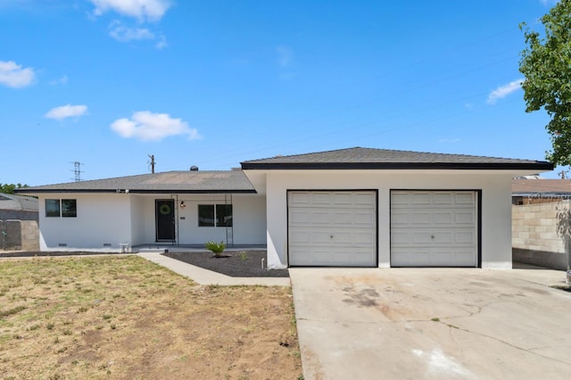 4641 E Weldon Ave, Fresno, CA 93703 - ranch-style home featuring an attached garage, driveway, and stucco siding