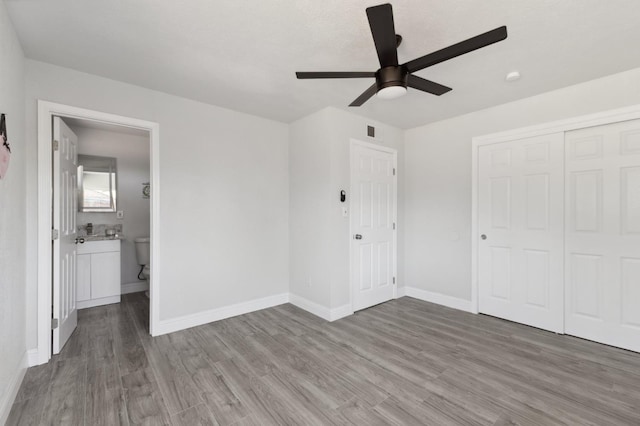 4641 E Weldon Ave, Fresno, CA 93703 - unfurnished bedroom featuring wood finished floors, baseboards, a closet, and a ceiling fan