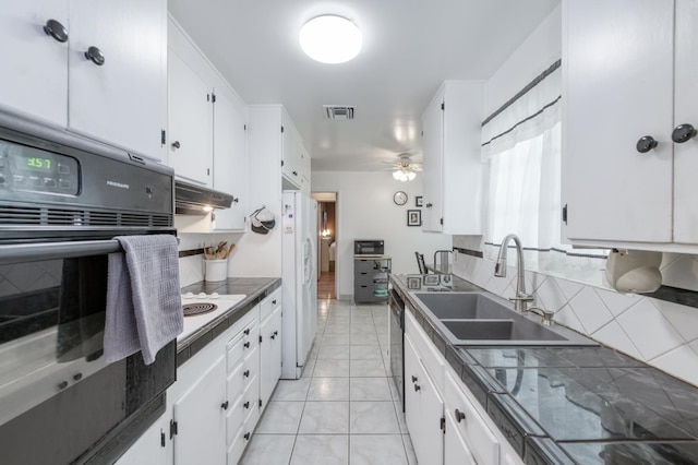 3979 N Pleasant Ave, Fresno, CA 93705 - kitchen featuring black appliances, a sink, white cabinets, and a ceiling fan