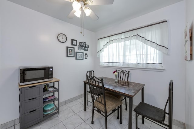 3979 N Pleasant Ave, Fresno, CA 93705 - dining space with ceiling fan and light tile patterned floors