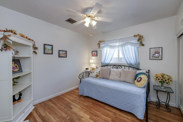 3979 N Pleasant Ave, Fresno, CA 93705 - bedroom with wood finished floors, baseboards, and ceiling fan