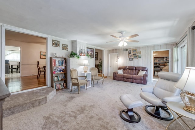 3979 N Pleasant Ave, Fresno, CA 93705 - living room featuring a ceiling fan, crown molding, and carpet floors