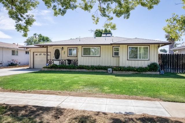 3979 N Pleasant Ave, Fresno, CA 93705 - ranch-style home with a garage, driveway, and board and batten siding
