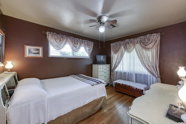 3979 N Pleasant Ave, Fresno, CA 93705 - bedroom featuring wood finished floors and a ceiling fan