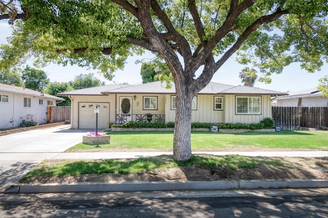 3979 N Pleasant Ave, Fresno, CA 93705 - single story home with a garage, concrete driveway, and board and batten siding