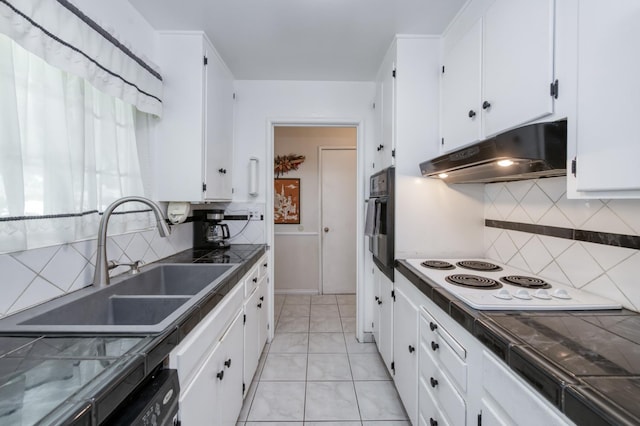 3979 N Pleasant Ave, Fresno, CA 93705 - kitchen with under cabinet range hood, a sink, white electric stovetop, and dark countertops