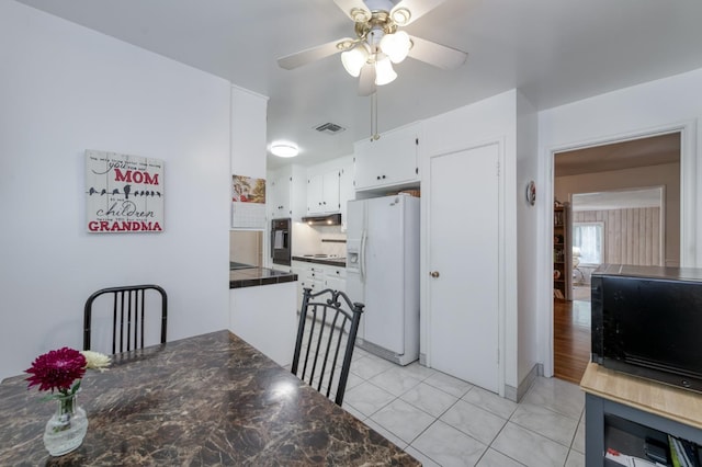 3979 N Pleasant Ave, Fresno, CA 93705 - dining space with ceiling fan and light tile patterned floors