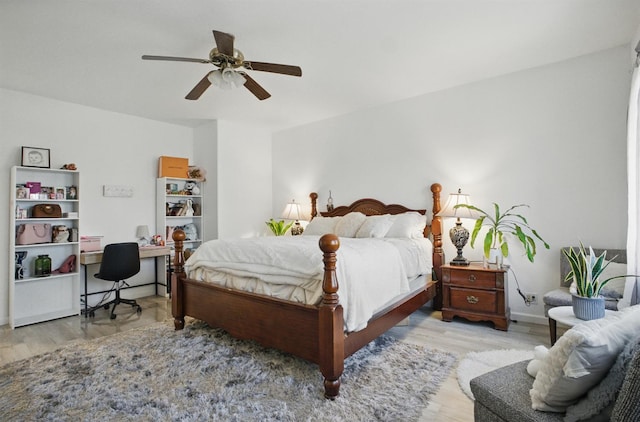 1216 Avignon Dr, Merced, CA 95348 - bedroom with wood finished floors, a desk, a ceiling fan, and baseboards