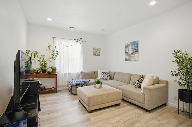 1216 Avignon Dr, Merced, CA 95348 - living room with light wood-style flooring, recessed lighting, and baseboards