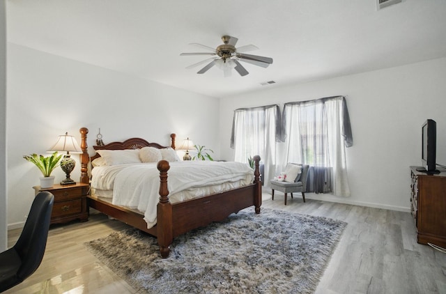 1216 Avignon Dr, Merced, CA 95348 - bedroom featuring light wood finished floors, a ceiling fan, and baseboards