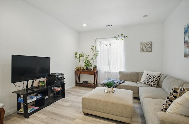 1216 Avignon Dr, Merced, CA 95348 - living room featuring light wood-type flooring, baseboards, and recessed lighting