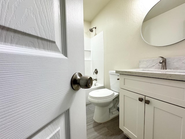 4221 E Grant Ave, Fresno, CA 93702 - full bathroom with vanity, bathtub / shower combination, toilet, and wood finished floors