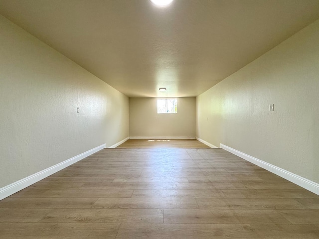 4221 E Grant Ave, Fresno, CA 93702 - empty room with wood finished floors, baseboards, and a textured wall