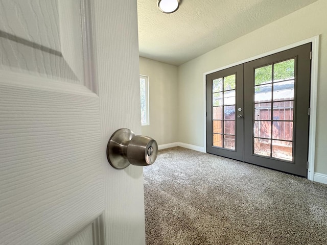 4221 E Grant Ave, Fresno, CA 93702 - unfurnished room with french doors, baseboards, carpet, and a textured ceiling
