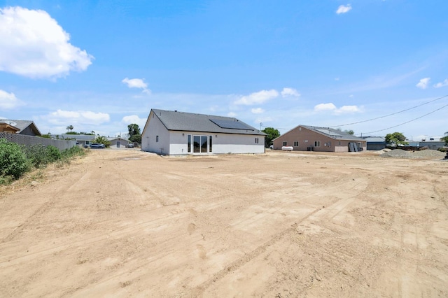 25900 Tanforan Dr, Madera, CA 93638 - back of house featuring roof mounted solar panels
