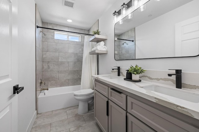 25900 Tanforan Dr, Madera, CA 93638 - bathroom with shower / bath combo, toilet, double vanity, and baseboards