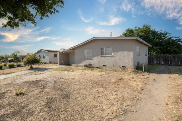 2108 E Sussex Way, Fresno, CA 93726 - single story home featuring a carport, crawl space, stucco siding, and driveway