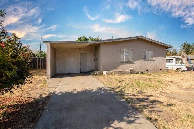 2108 E Sussex Way, Fresno, CA 93726 - view of front of property featuring concrete driveway, crawl space, a carport, and stucco siding