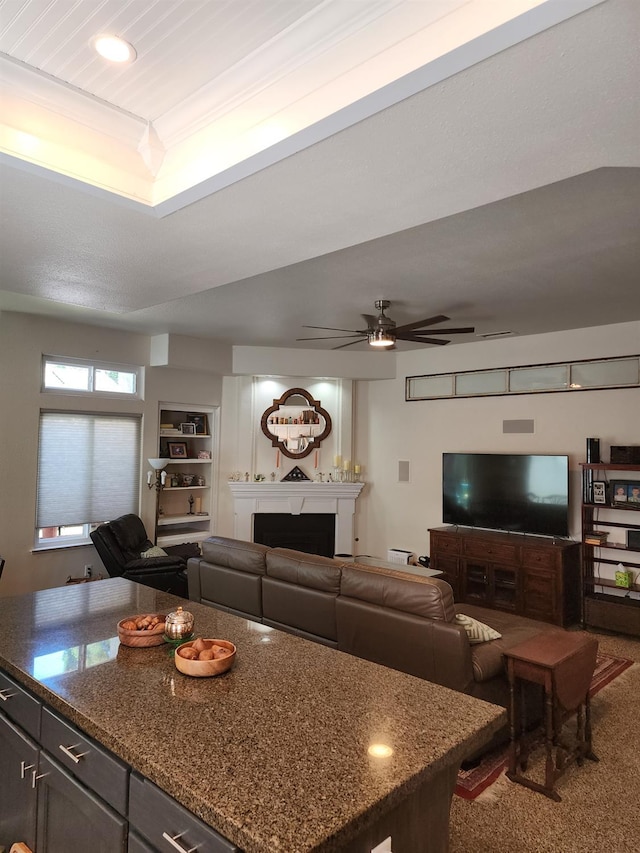 2513 Twain Ave, Clovis, CA 93611 - carpeted living room with a fireplace, a ceiling fan, and recessed lighting