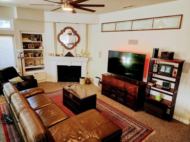 2513 Twain Ave, Clovis, CA 93611 - living room with a ceiling fan, carpet, and built in shelves
