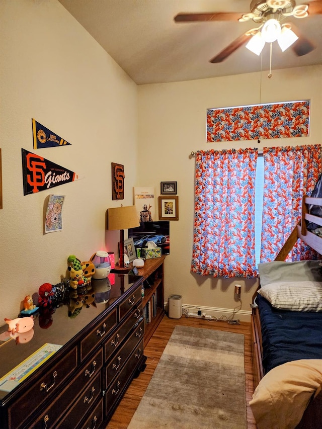 2513 Twain Ave, Clovis, CA 93611 - bedroom with wood finished floors, a ceiling fan, and baseboards