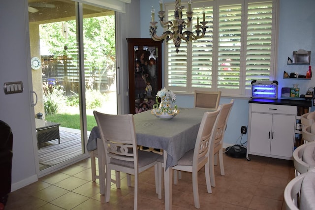 4058 Chessa Ln, Clovis, CA 93619 - dining area with a chandelier and light tile patterned floors