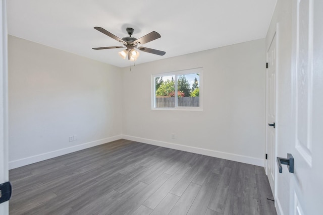 513 Waldo, Exeter, CA 93221 - empty room featuring dark wood finished floors, baseboards, and a ceiling fan