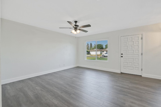 513 Waldo, Exeter, CA 93221 - unfurnished room with dark wood-style flooring, ceiling fan, and baseboards