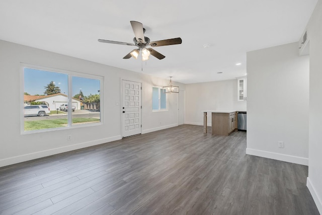 513 Waldo, Exeter, CA 93221 - unfurnished living room featuring a chandelier, ceiling fan, dark wood-style floors, baseboards, and recessed lighting
