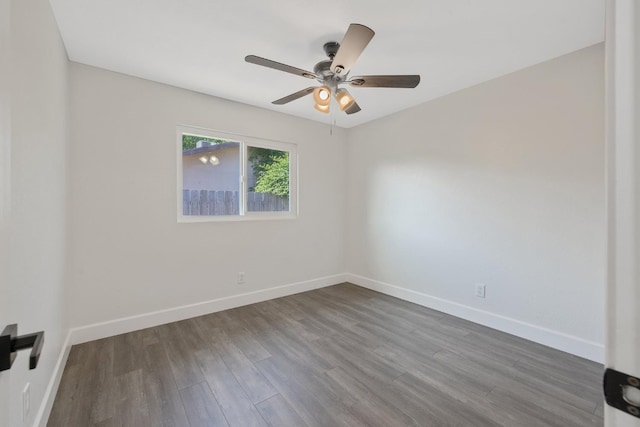 513 Waldo, Exeter, CA 93221 - unfurnished room with dark wood-type flooring, baseboards, and ceiling fan