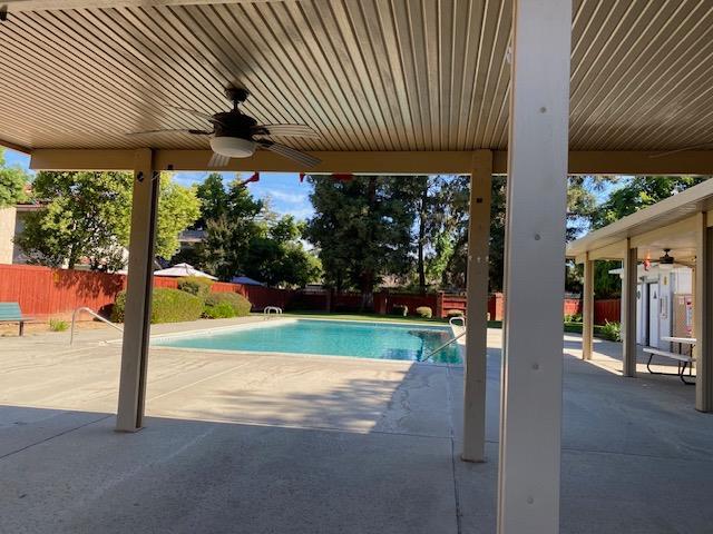 485 E Alluvial Ave Unit 102, Fresno, CA 93720 - view of pool featuring ceiling fan, a fenced backyard, and a patio area