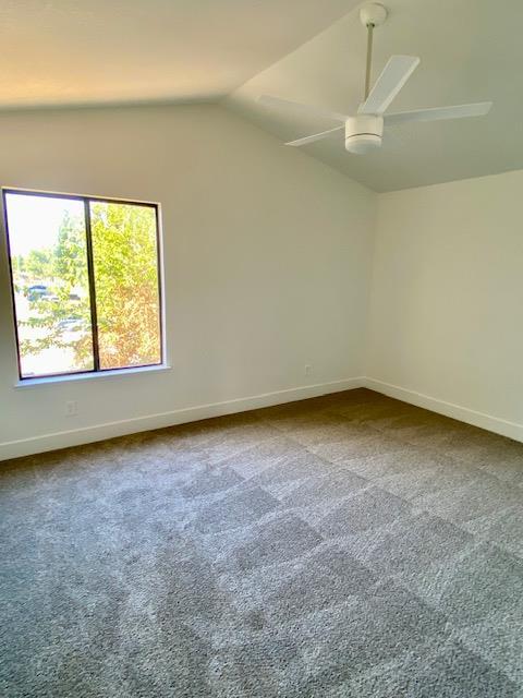 485 E Alluvial Ave Unit 102, Fresno, CA 93720 - additional living space featuring a ceiling fan, carpet flooring, vaulted ceiling, and baseboards