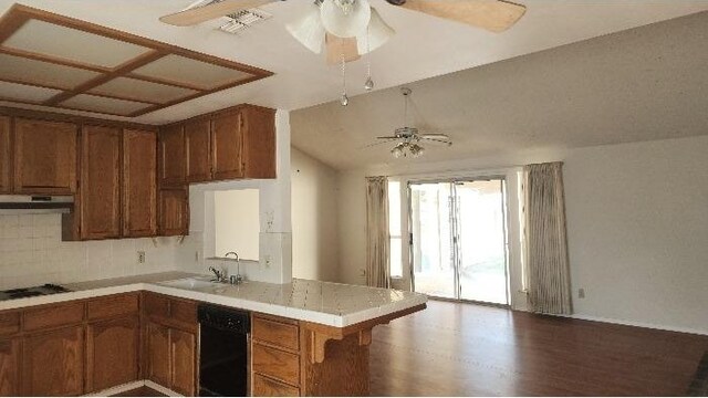 6377 N Genoa Ave, Fresno, CA 93722 - kitchen featuring ceiling fan, dishwasher, a peninsula, a sink, and brown cabinets