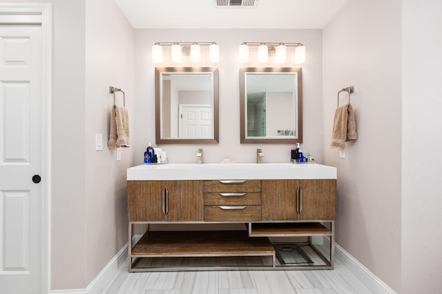 8814 N Spalding, Fresno, CA 93720 - bathroom featuring double vanity and baseboards