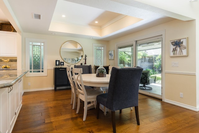 499 E Braddock Dr, Fresno, CA 93720 - dining space featuring a raised ceiling, dark wood-type flooring, baseboards, recessed lighting, and crown molding