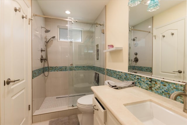 499 E Braddock Dr, Fresno, CA 93720 - bathroom featuring tile walls, toilet, a stall shower, vanity, and tile patterned floors
