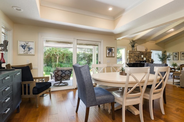 499 E Braddock Dr, Fresno, CA 93720 - dining room with plenty of natural light, hardwood / wood-style flooring, a stone fireplace, crown molding, and recessed lighting