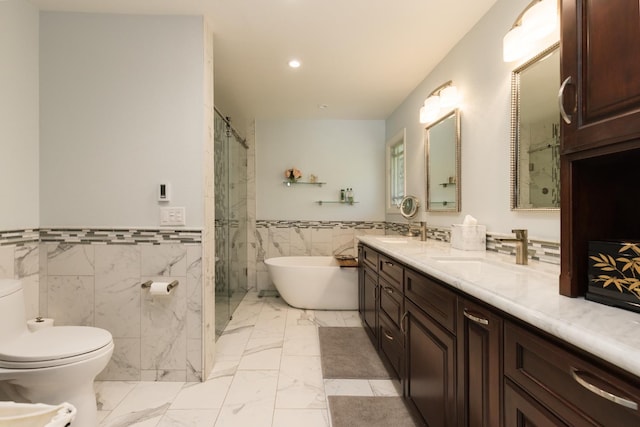 499 E Braddock Dr, Fresno, CA 93720 - full bath featuring tile walls, marble finish flooring, recessed lighting, a freestanding tub, and a stall shower
