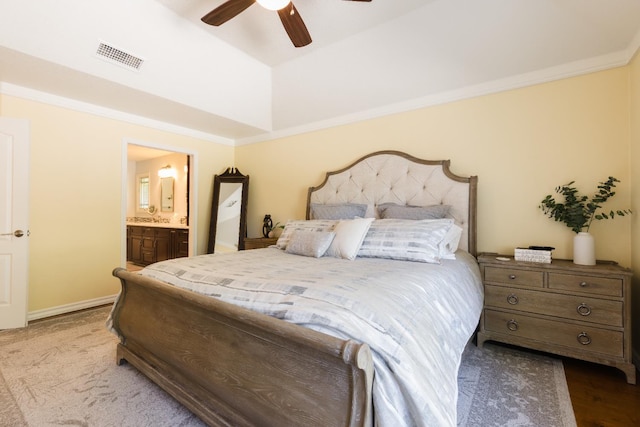 499 E Braddock Dr, Fresno, CA 93720 - bedroom featuring a raised ceiling, connected bathroom, ceiling fan, and crown molding