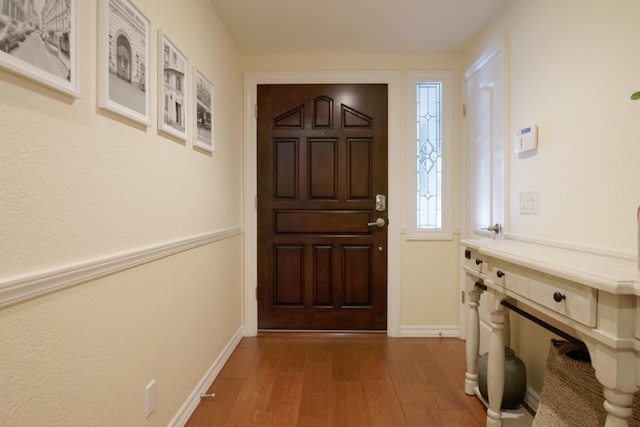499 E Braddock Dr, Fresno, CA 93720 - foyer entrance with wood finished floors and baseboards
