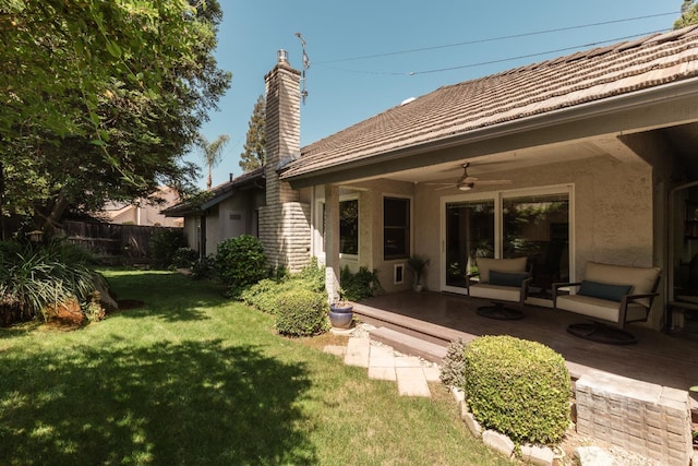 499 E Braddock Dr, Fresno, CA 93720 - rear view of property featuring ceiling fan, stucco siding, and a chimney