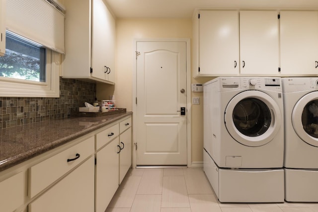 499 E Braddock Dr, Fresno, CA 93720 - laundry area with independent washer and dryer, cabinet space, and light tile patterned flooring