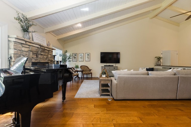 499 E Braddock Dr, Fresno, CA 93720 - living area featuring a fireplace, beam ceiling, wood finished floors, high vaulted ceiling, and ceiling fan