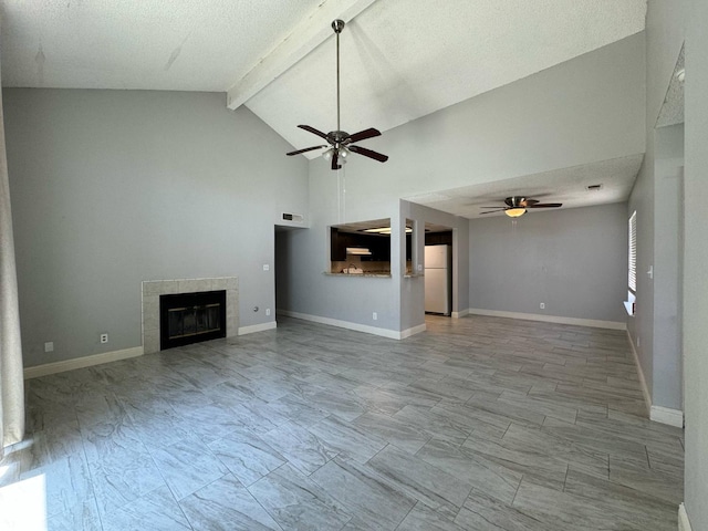 2761 N Selland, Fresno, CA 93722 - unfurnished living room with ceiling fan, a fireplace, beam ceiling, high vaulted ceiling, and baseboards