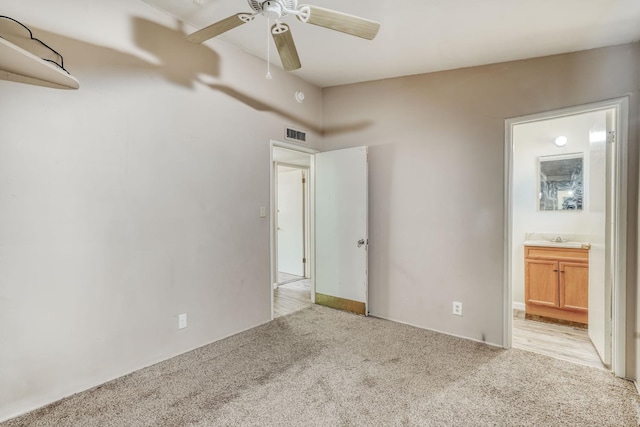 6298 N Glenn Ave, Fresno, CA 93704 - unfurnished bedroom with light carpet, a sink, connected bathroom, and ceiling fan