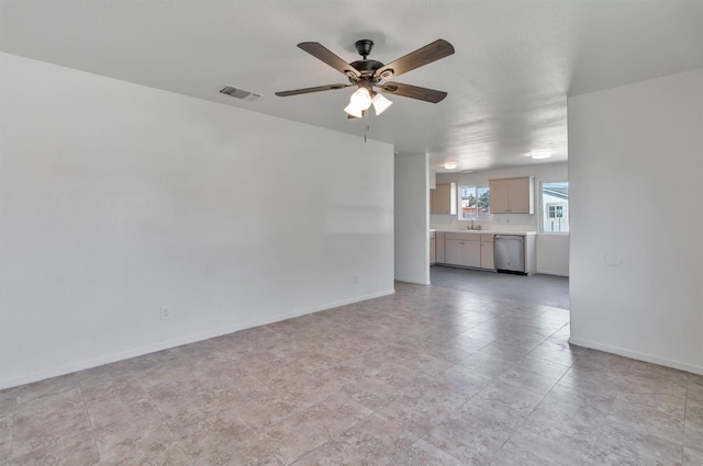 829 W Woodward Ave, Fresno, CA 93706 - unfurnished living room featuring ceiling fan, a sink, and baseboards